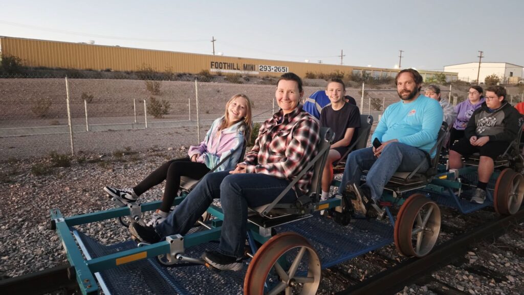 photo of a family of four on the rail bike.